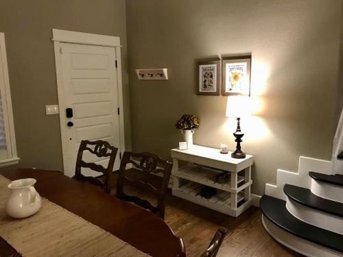 a dining room with a table and a table and chairs at BoCo Bungalow in Superior