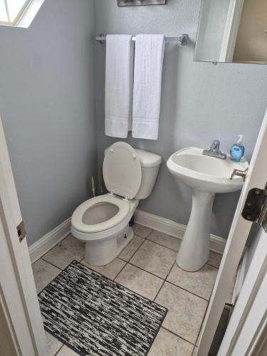 a bathroom with a toilet and a sink at Best location Cozy condo in Biloxi Beach in Biloxi