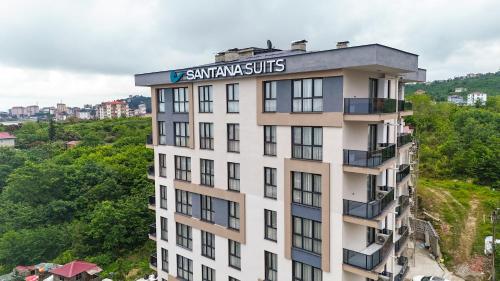 an apartment building with a sign on top of it at Santana Suıts in Trabzon