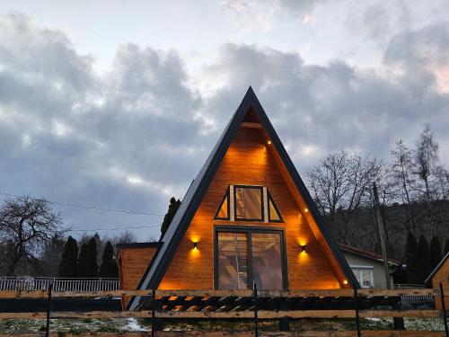 a small wooden house with a triangular roof at Moonrise house Rudnik in Rudnik