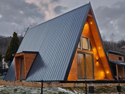 a house with a metal roof on top of it at Moonrise house Rudnik in Rudnik
