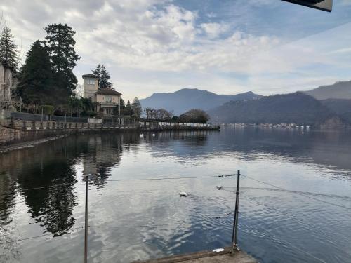 a view of a large body of water with mountains at Botel Diffuso dei Laghi in Porto Ceresio
