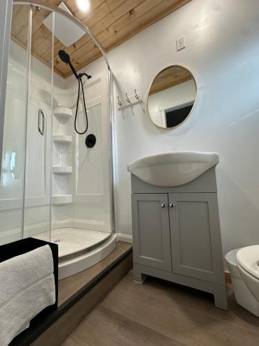 a bathroom with a sink and a shower at Greenside Motel in Saint Andrews