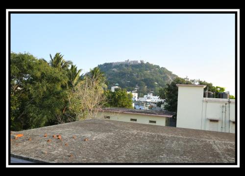 a view from the roof of a house with a mountain at Pattiah Naidu Palace in Palani