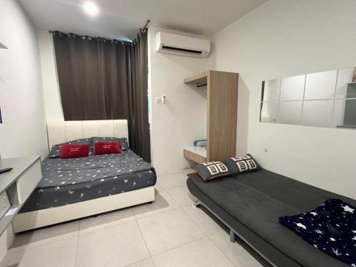 a bedroom with two beds in a room at Studio at dMillenia Residences in Kota Samarahan