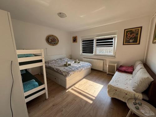 a bedroom with a bunk bed and a bunk bed at Apartma Laganini in Bosiljevo