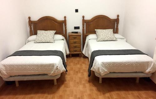 Katil atau katil-katil dalam bilik di Hostal La Casilla