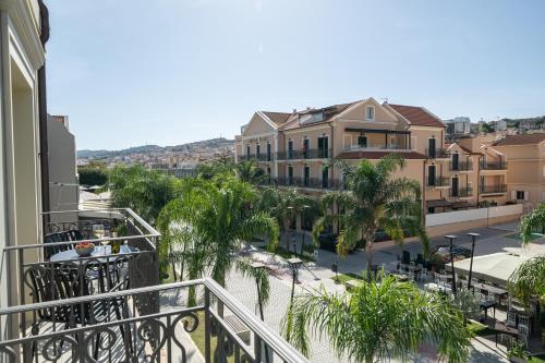 a balcony with a view of a street and buildings at KANTADA central suite in Argostoli