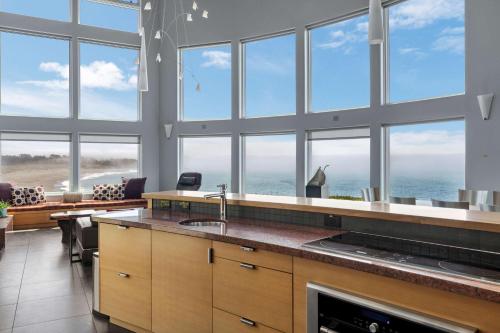 a large kitchen with a view of the ocean at Pacific Bliss Haven in Gualala