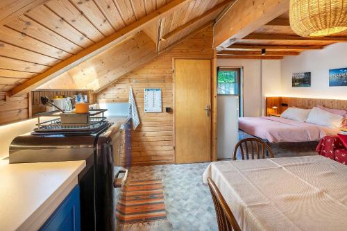 a room with a bedroom and a bed in a house at Casa Morsich in Predazzo
