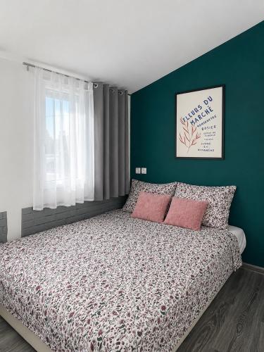 a bedroom with a bed with two pink pillows at Villa Pantheon Mostar in Blagaj