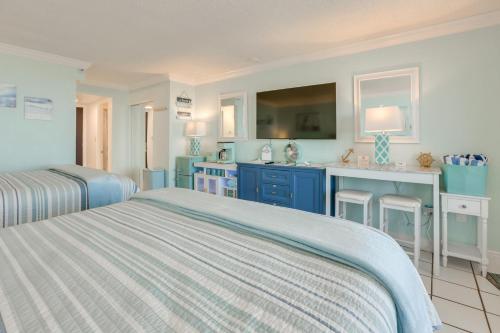 a bedroom with two beds and a sink at Daytona Beach Studio w/ Ocean View + Amenities! in Daytona Beach