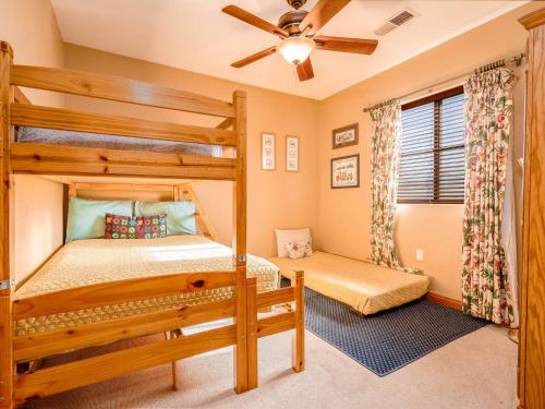 a bedroom with a bunk bed and a ceiling fan at Condo 40-4 El Dorado Ranch in San Felipe