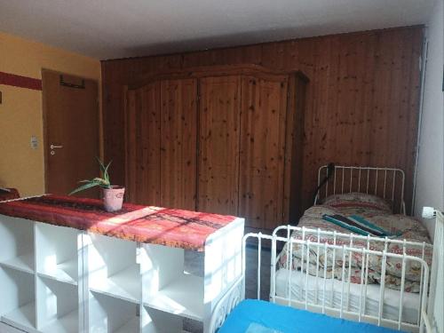 a bedroom with a bed and a wooden wall at Ruhige Ortsrandlage 1 in Kiel