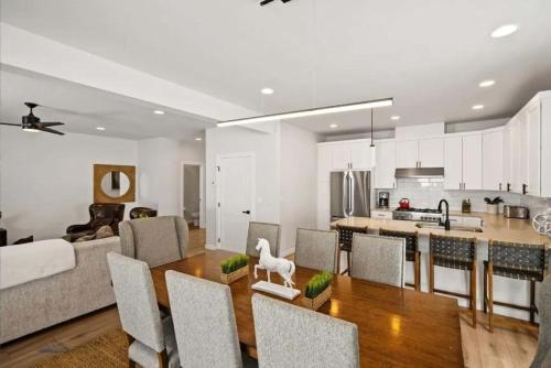 a kitchen and living room with a table and chairs at Cozy Luxury in Big Sky in Big Sky