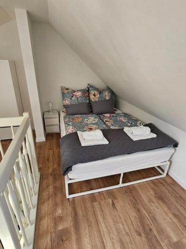 a small bedroom with a bed in a attic at Talblick Saschwalle in Sasbachwalden