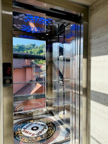 a glass door with a window with a view at Hotel Casablanca in Goražde