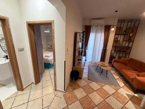 a living room with a couch and a table at PRCPORTOapartmani in Herceg-Novi