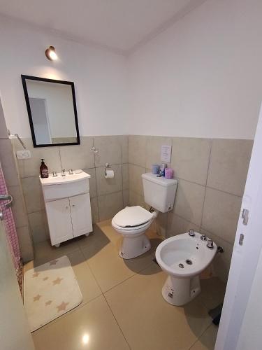 a bathroom with a toilet and a sink at SAN jose in Federación