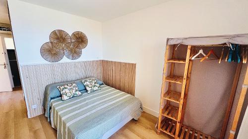 a bedroom with a bed and a book shelf at Location corsica in Ajaccio