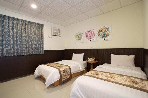 Voodi või voodid majutusasutuse Fuga Hotel toas