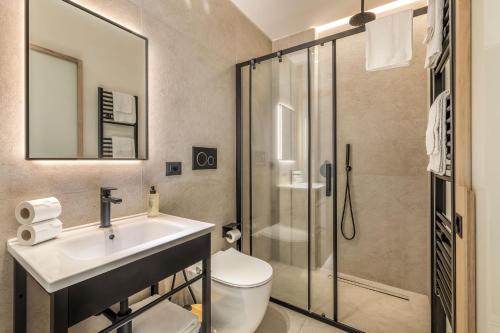 a bathroom with a toilet and a sink and a shower at Grafea - Luxury stay in Catania in Catania