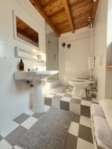 a bathroom with a sink and a toilet at Casa Antonietta in Domaso