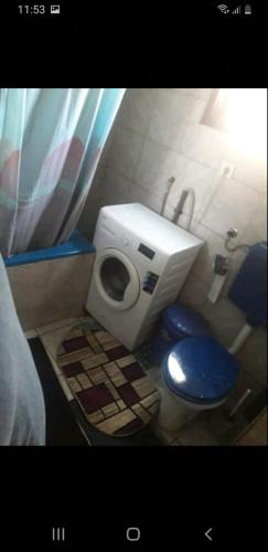 a small bathroom with a toilet and a sink at Camping Struga Macedonia in Struga