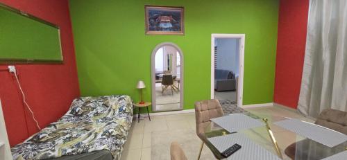 a living room with a couch and a table at Residence APOLLO MJ z dwoma pokojami in Ząbkowice Śląskie