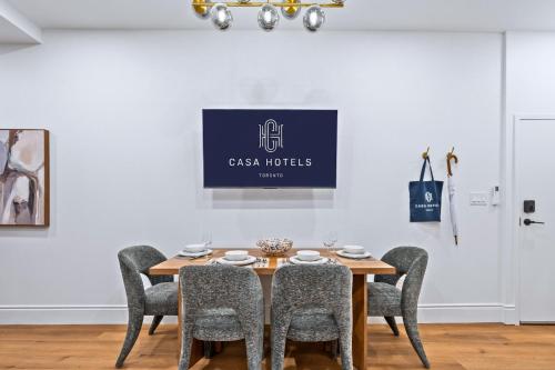 a dining room with a table and chairs at Casa Hotels Gerrard Newly Built Suite Steps to Transit in Toronto