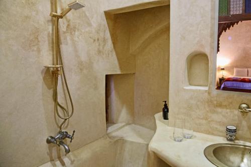 a bathroom with a shower and a sink at Riad Azula in Salé