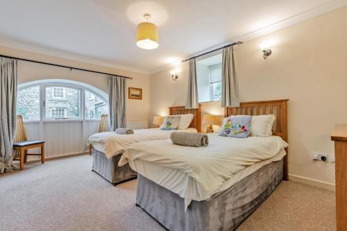 a bedroom with two beds and a window at 3 Bed in Bishop Auckland oc-36671 in Wolsingham