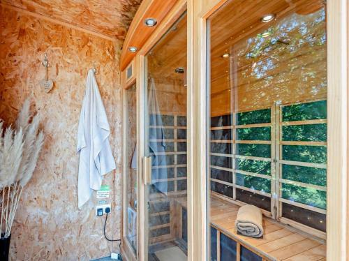 a glass shower in a bathroom with a window at 3 Bed in Ledbury oc-77378 in Wilton