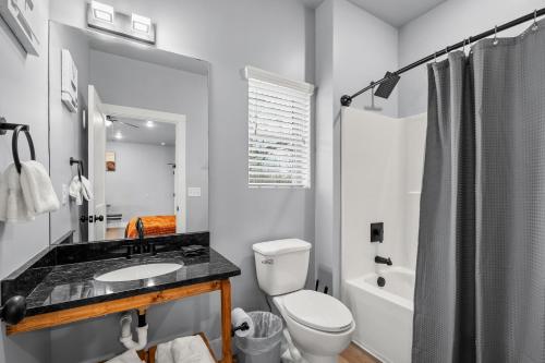 a white bathroom with a sink and a toilet at #7 Studio Town Place 2 in Sevierville