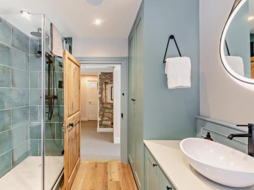 a bathroom with a sink and a shower at 3 Bed in Settle oc-92466 in Settle