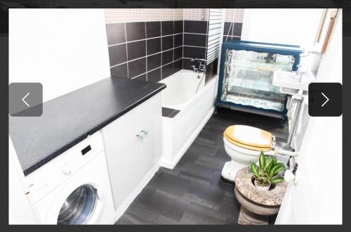 a bathroom with a toilet and a sink at City Centre Double Room in Truro