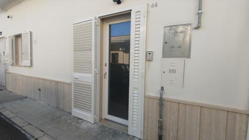 an open door to a building with a window at D&M House Salento in Nardò