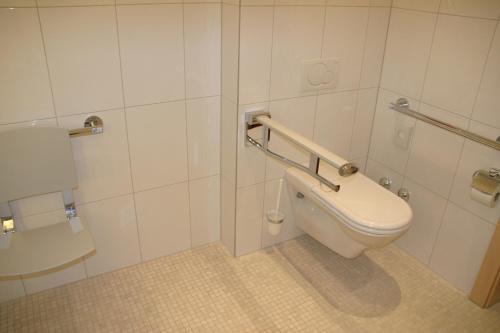 a bathroom with a toilet at Austria Classic Hotel Heiligkreuz in Hall in Tirol