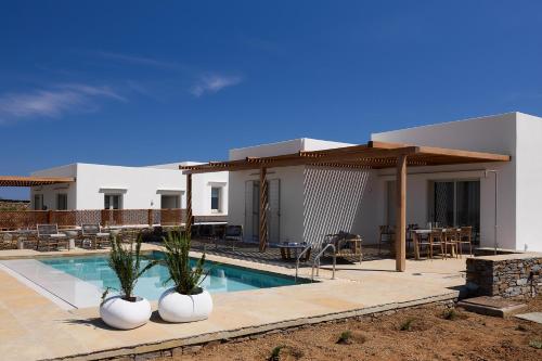 a villa with a swimming pool and a house at Didimos Luxury Villas in Cherronisos