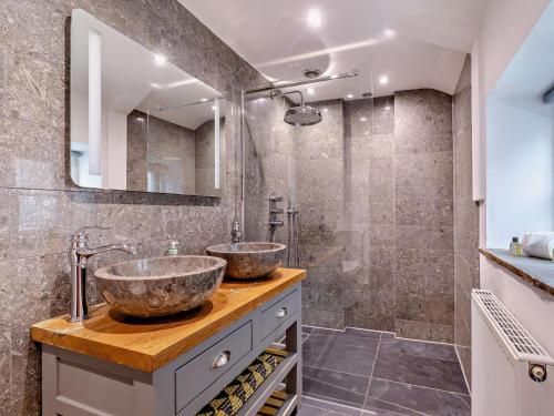 a bathroom with two sinks and a shower at 1 Bed in Matlock oc-75400 in Middleton