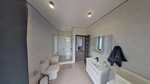a bathroom with a toilet and a tub and a sink at Mughni home in Ashtarak