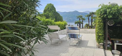a group of chairs sitting on a patio at The Hidden Gem, Lago Maggiore in Germignaga