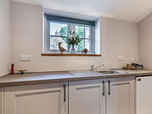 a kitchen counter with a sink and a window at 2 Bed in Stoke-on-trent oc-95164 in Longton