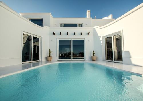 a swimming pool in the backyard of a house at Villa Lore by Villalize in Teguise