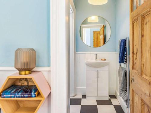 a bathroom with a sink and a mirror at 1 Bed in Chulmleigh oc-88862 in Chawleigh