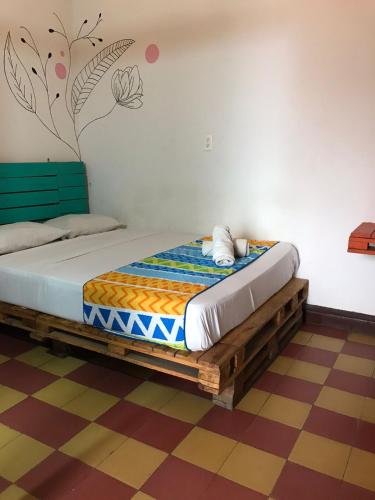 a bedroom with a bed in a room at The Best Adventure Hostel in San Gil