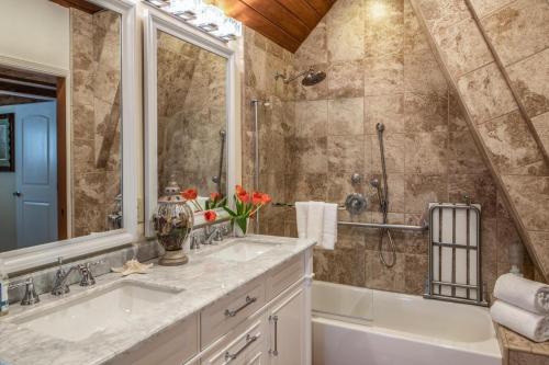 a bathroom with two sinks and a shower at 3796 The Madden Suite in Carmel