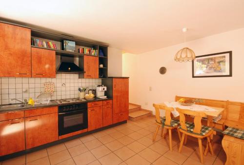 a kitchen with a table and a dining room at Serenita in Gambarogno