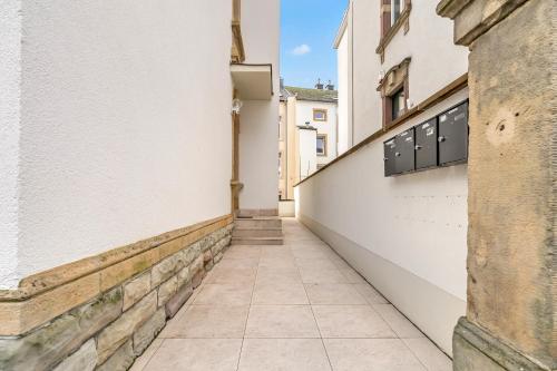 an alleyway between two buildings in a city at Résidence Welter Luxembourg in Luxembourg