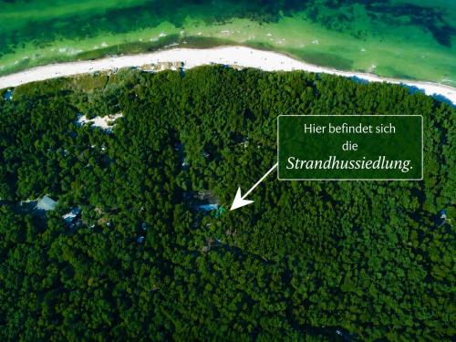 an aerial view of a island with a white lighthouse at Erholung pur in der Strandhussiedlung Rügen - Bungalow Ferienwohnung - bis 5 Personen - nur 100m zum Naturstrand - mitten im Kiefernwald - Ideal für Paare & Familien - Hunde herzlich willkommen in Dranske